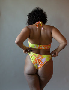 bikini top seen from the back in a multi colored pattern