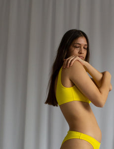 high coverage bikini top with open back in lemon yellow